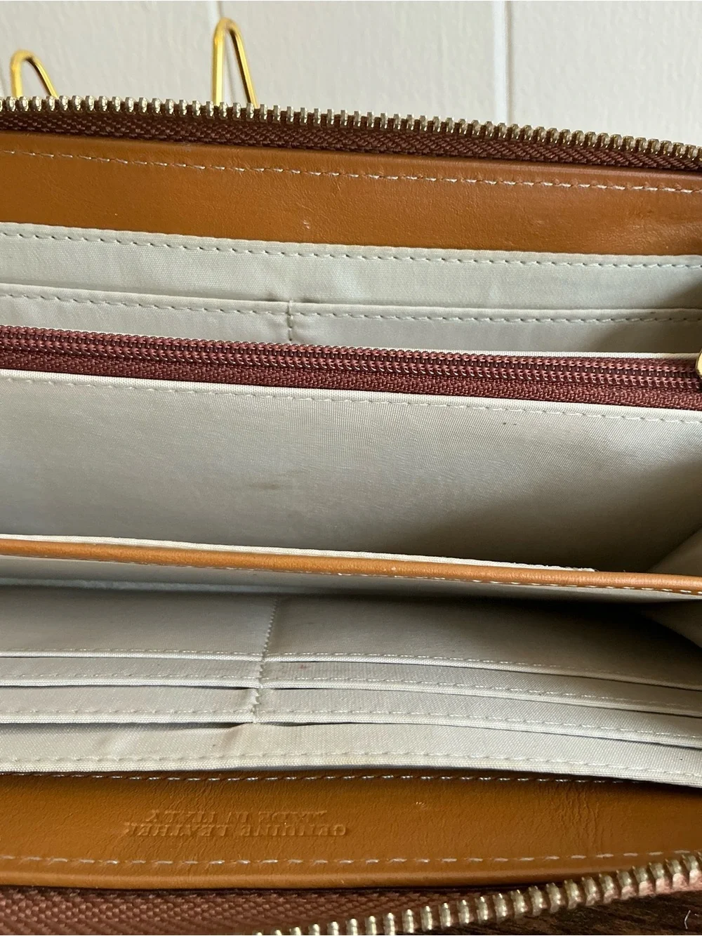 A rare vintage Adrienne Vittadini cognac color zip around leather wallet